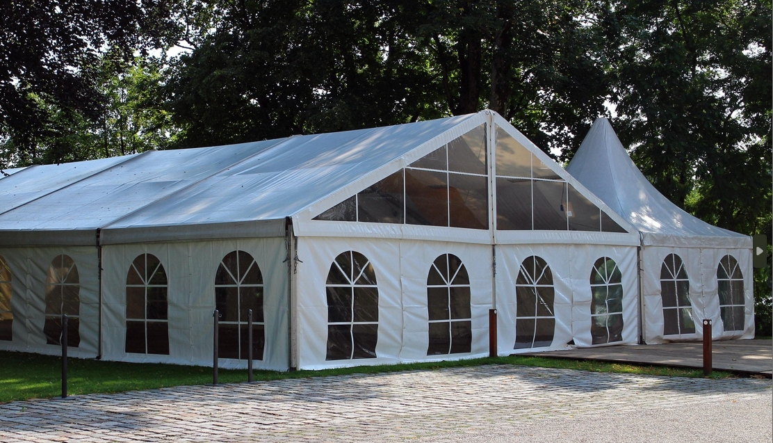 An enclosed frame tent for large outdoor events