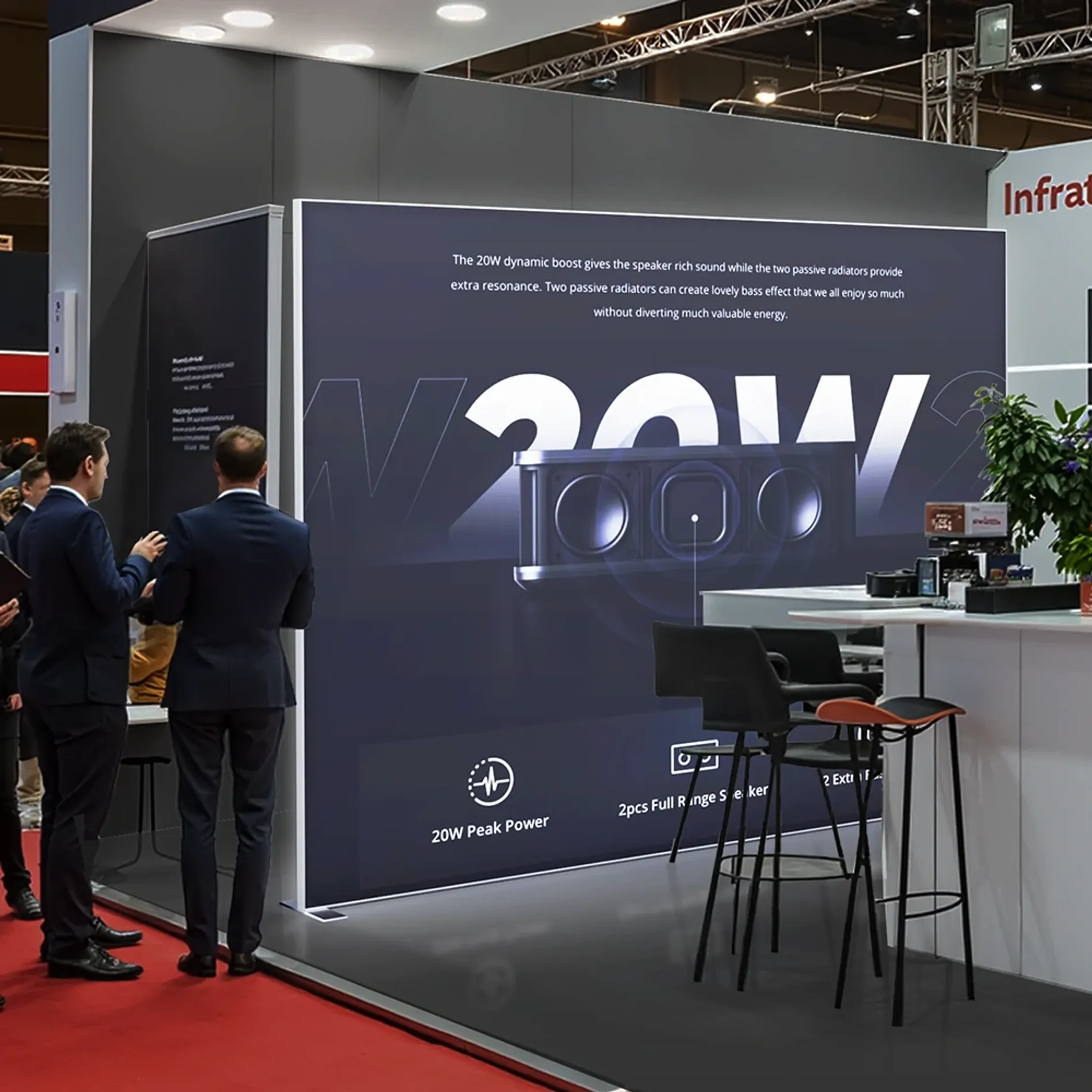 Backlit display wall at a trade show featuring a 20W speaker promotion.