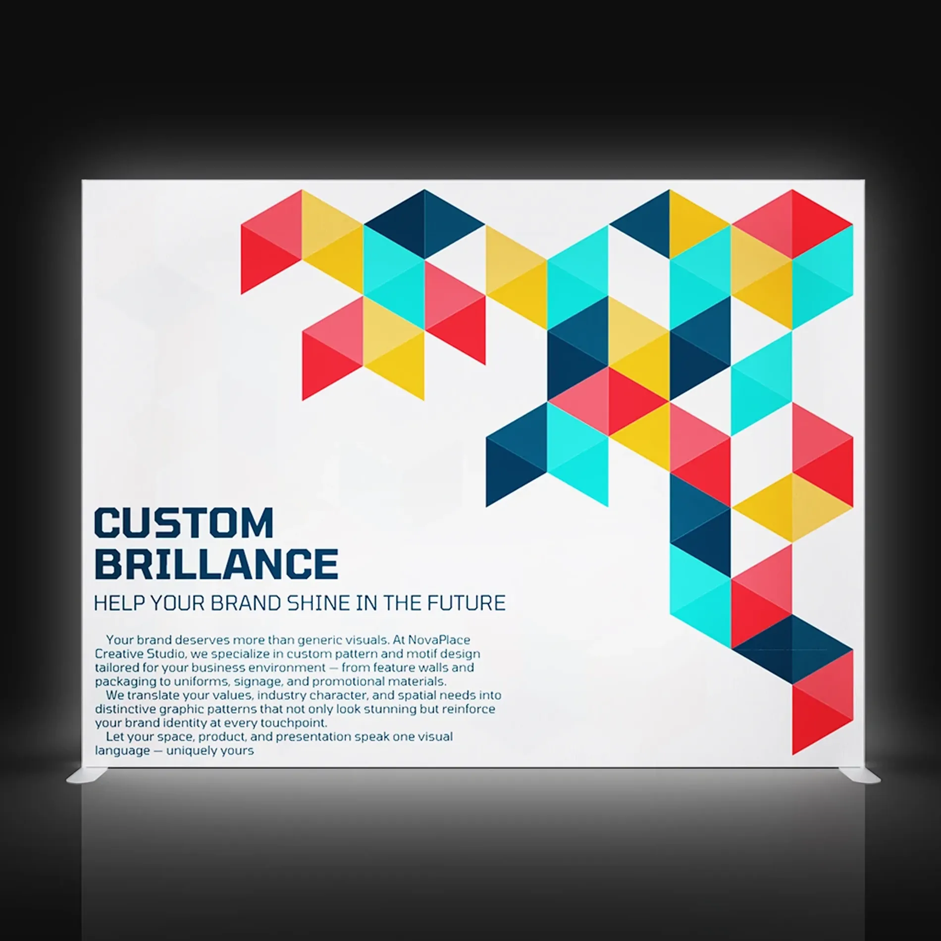 Front-facing view of a white display wall featuring colorful triangle patterns for exhibition use.