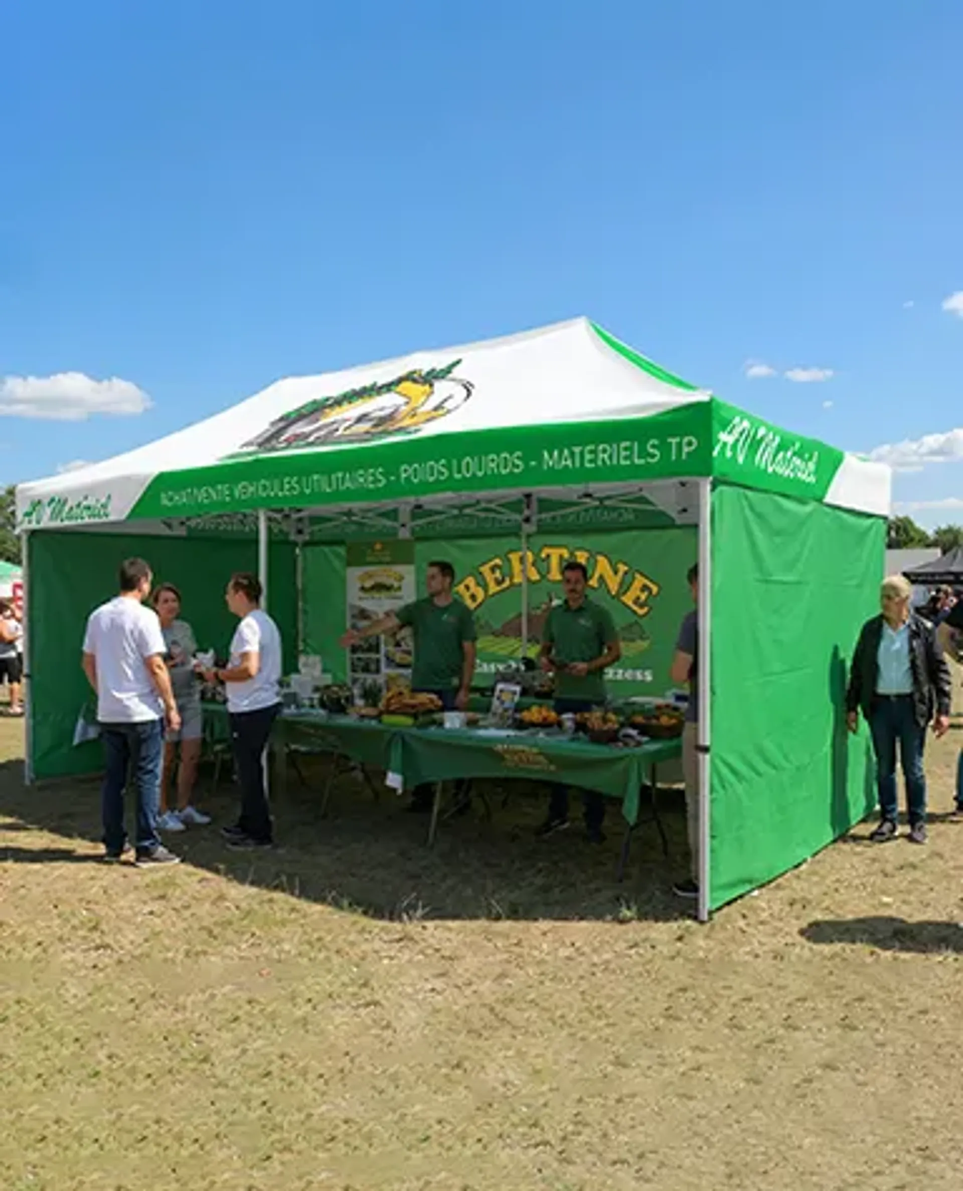 A green and white custom canopy tent set up at an outdoor agricultural fair, operating as an exhibition booth for the brand "Albertine" where staff are displaying products on a table to attendees.