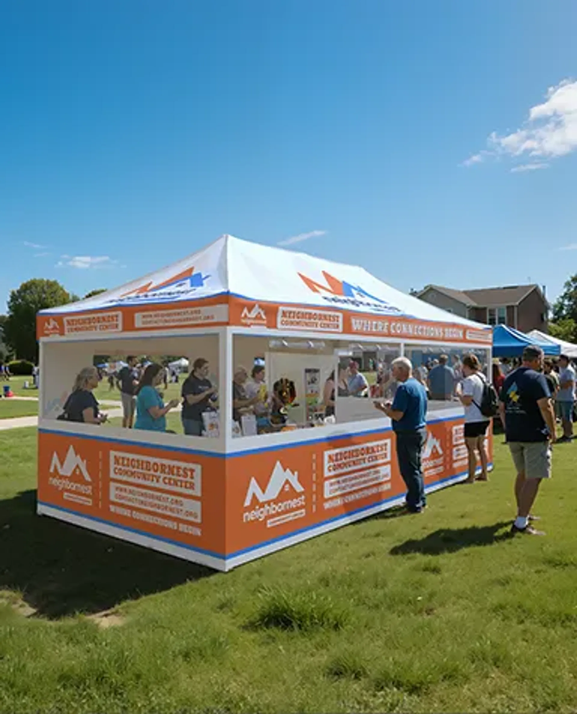 A bright orange and white custom event tent for the "NeighborNest Community Center" set up on a grassy field, featuring full branded side panels and acting as an outdoor promotional booth.