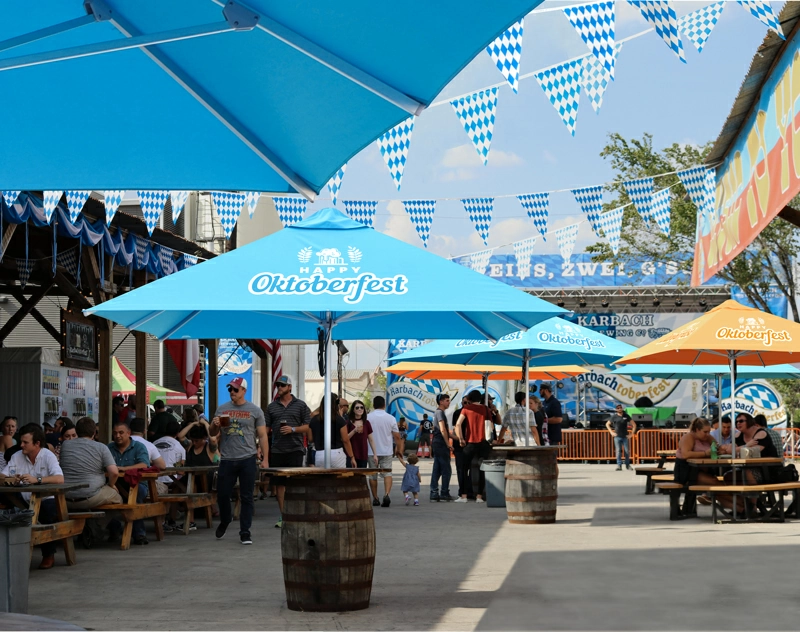 A market umbrella providing shade on a sunny day at an outdoor market.