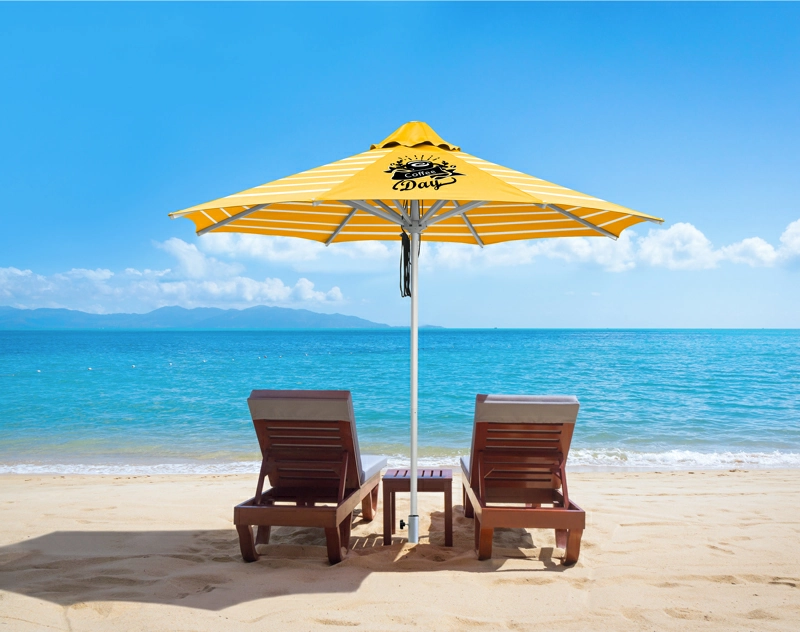 A yellow custom lounge umbrella by the beach provides shade for two lounge chairs