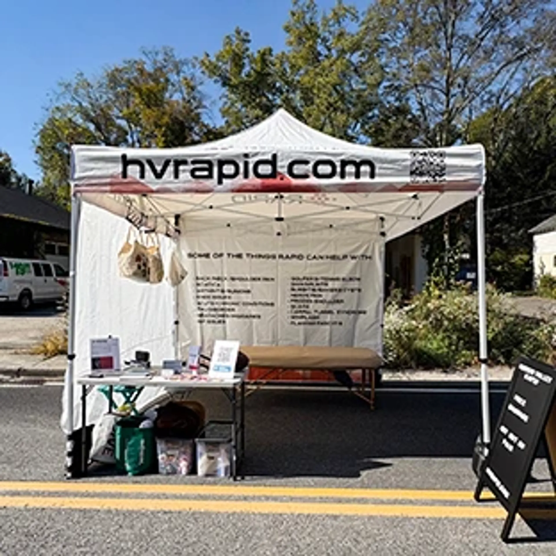 10x10 custom tent with logo and printed backwall for medical and professional services.