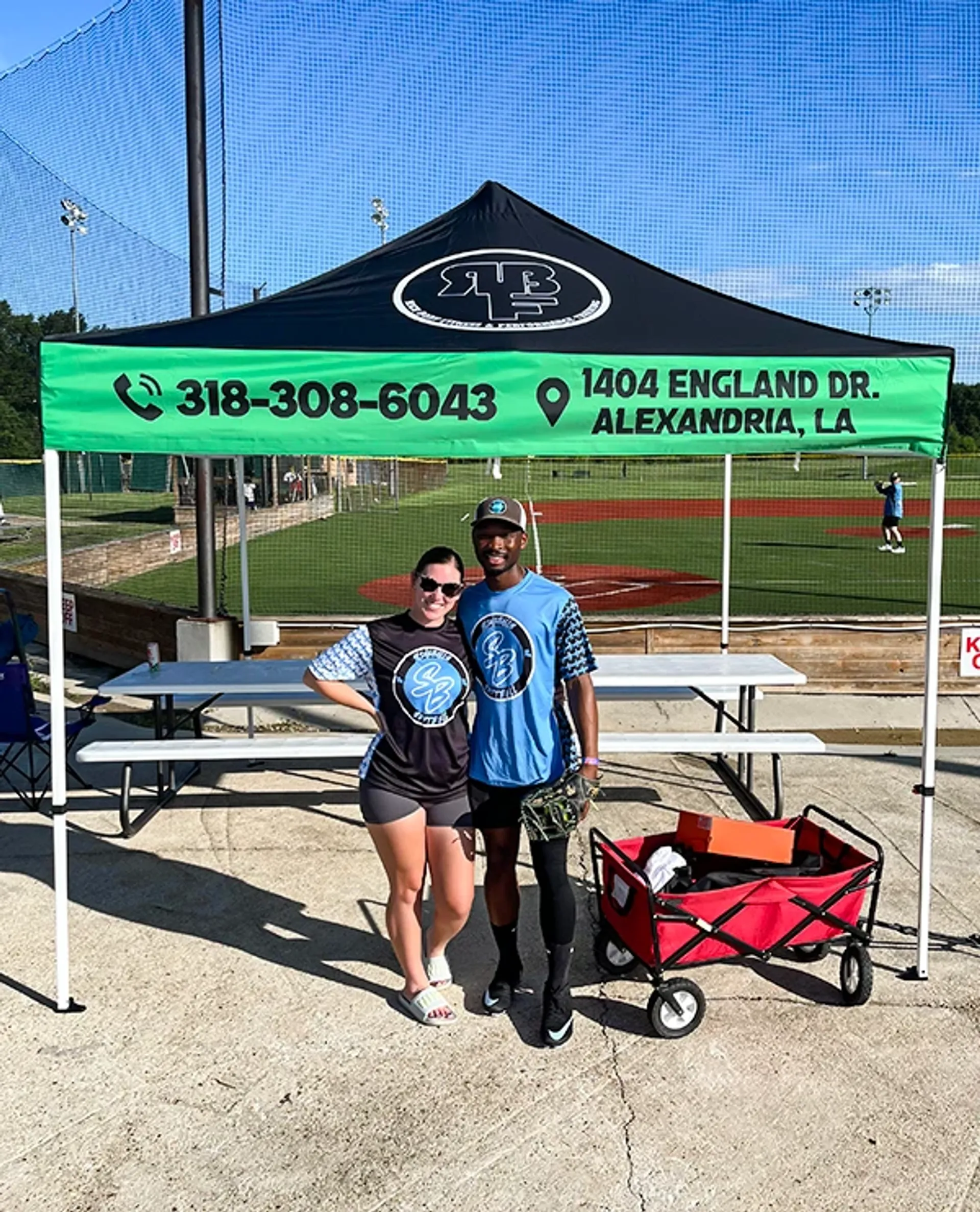 10x10 custom canopy tent with company logo and phone number for sideline branding.