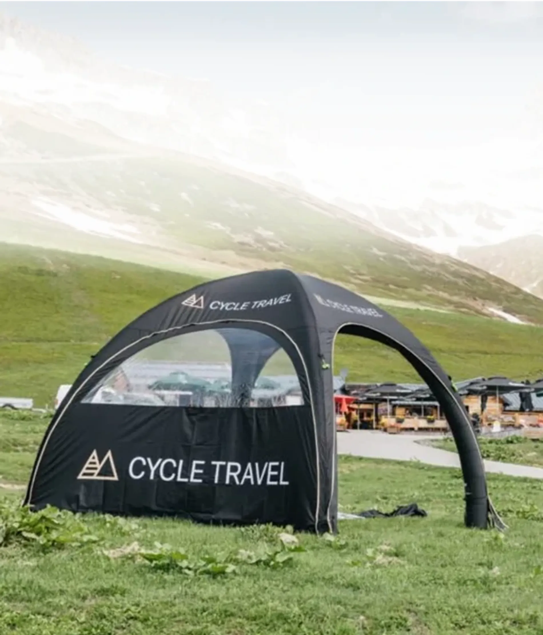 Custom inflatable tent with a wall on an outdoor lawn