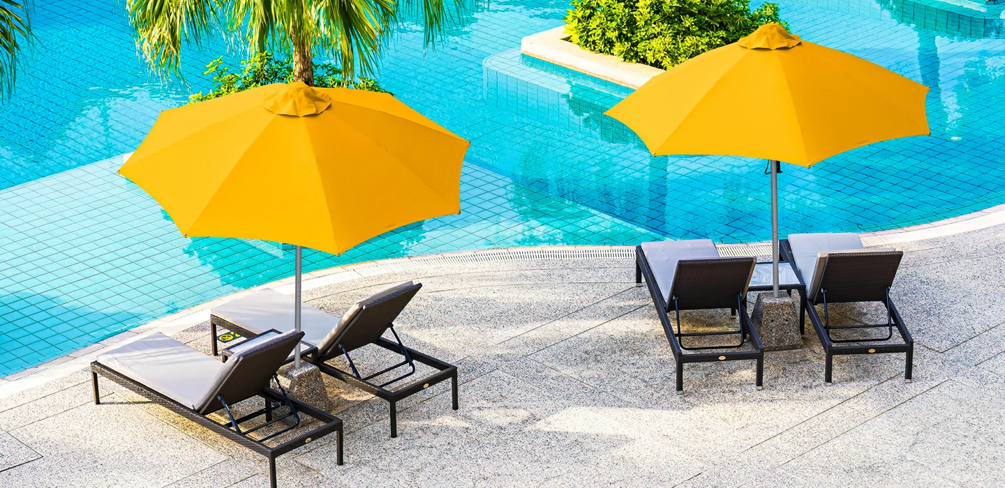 Santorini umbrella alongside swimming pool